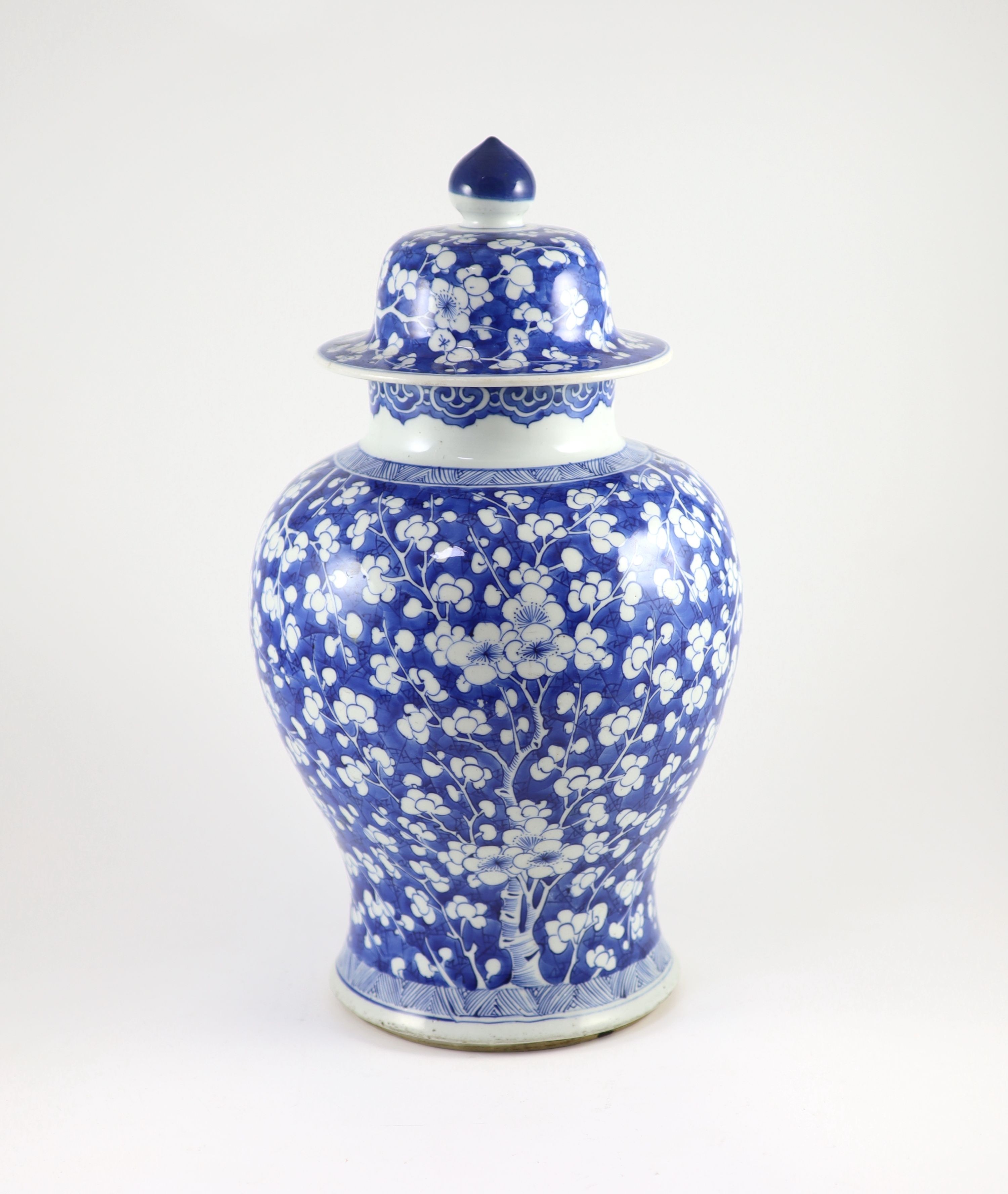 A good Chinese blue and white ‘prunus and cracked ice’ vase and cover, Kangxi period
